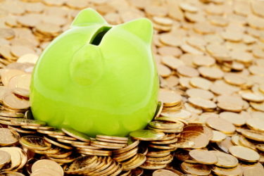 stockfresh_330895_green-piggy-bank-and-sea-of-gold-money_sizeXS