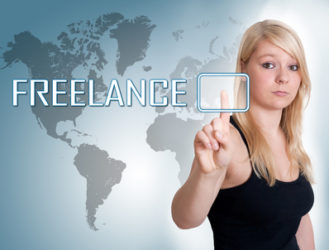 Young woman press digital Freelance button on interface in front of her